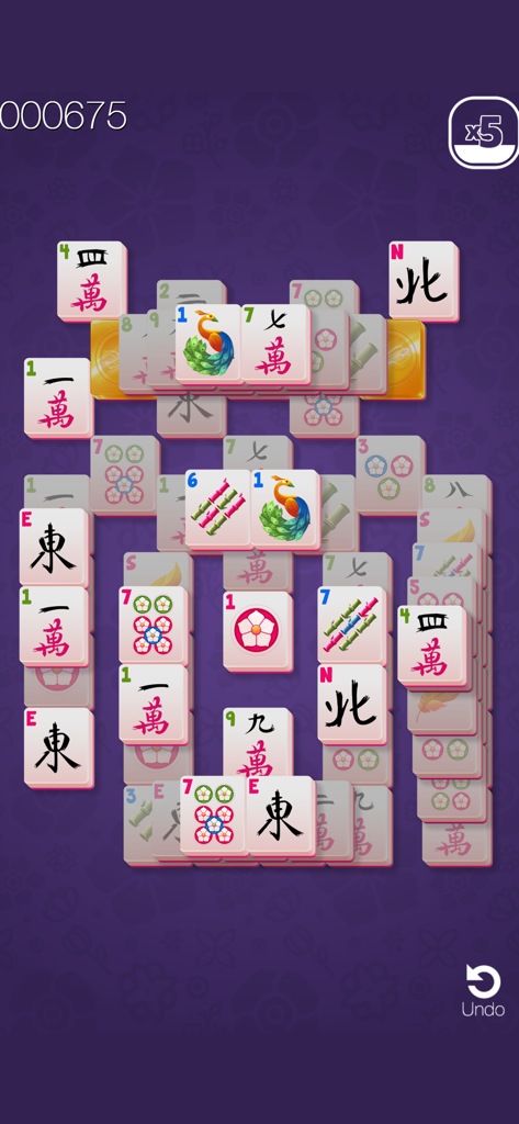 Gold Mahjong FRVR game board with traditional tiles and gold pieces