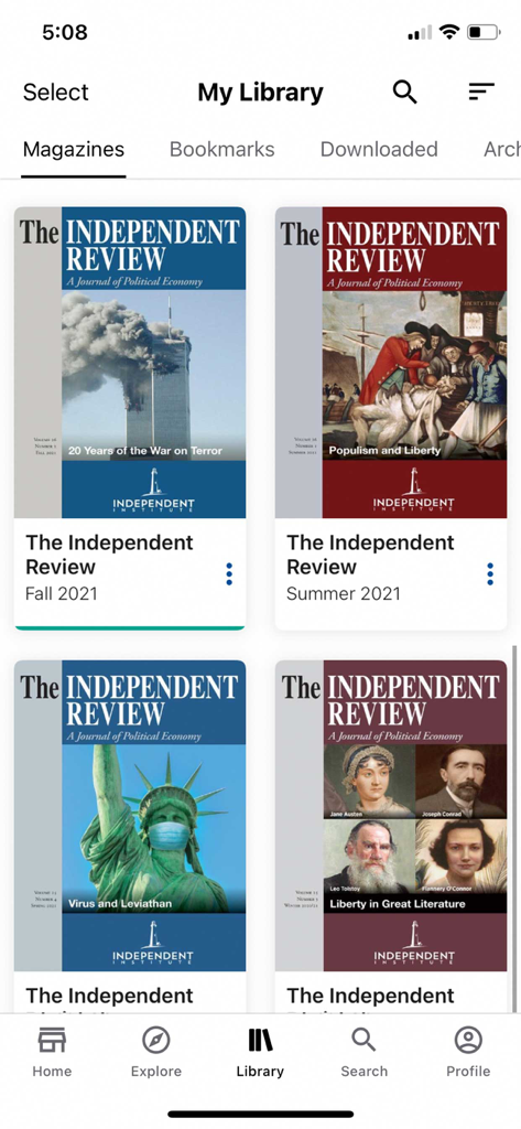 The My Library screen of The Independent Review app showing scholarly journal covers on topics like the War on Terror and Populism.