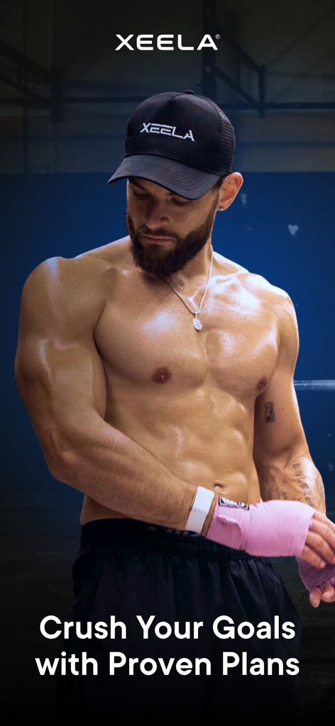 A muscular man in a gym wearing a Xeela hat with the text Crush Your Goals with Proven Plans