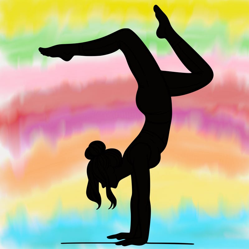 a woman doing a handstand
