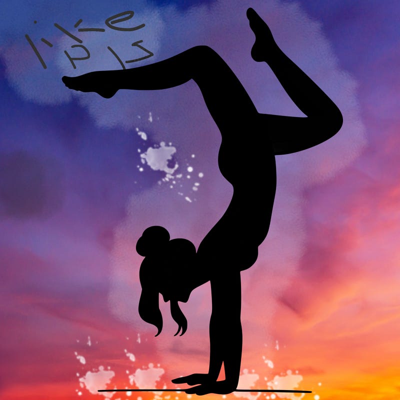 a woman doing a handstand