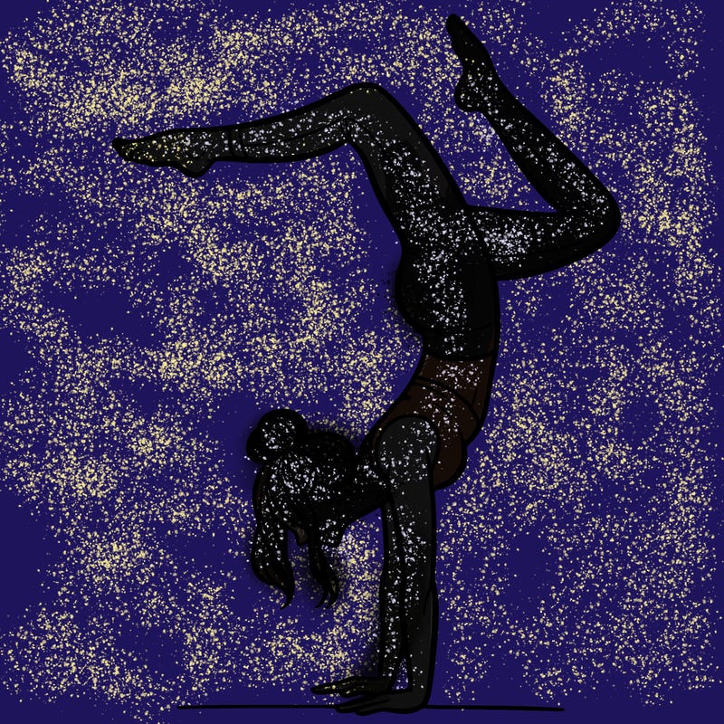 a woman doing a handstand