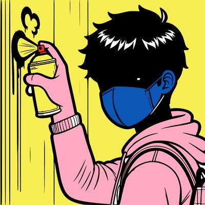 high schoolboy spray, painting a wall with mask covering his mouth