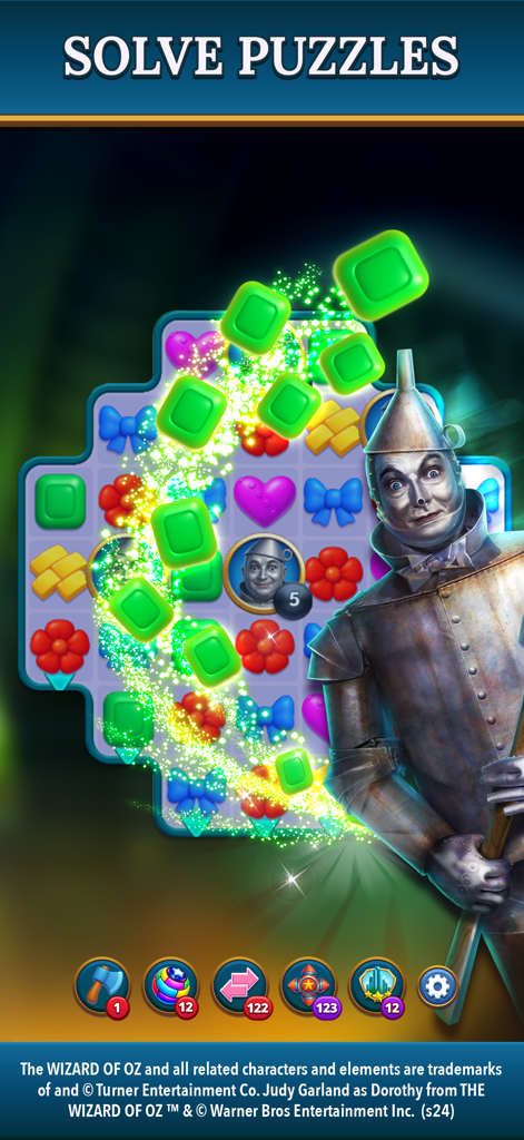 The Wizard of Oz Magic Match 3 - The Tin Man character standing next to a match three puzzle grid in the Wizard of Oz game