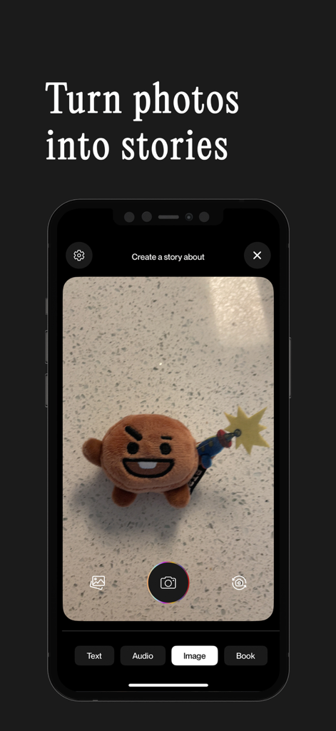 Interface do aplicativo Sleepytale mostrando uma visualização da câmera de um brinquedo de pelúcia com o título transforme fotos em histórias.