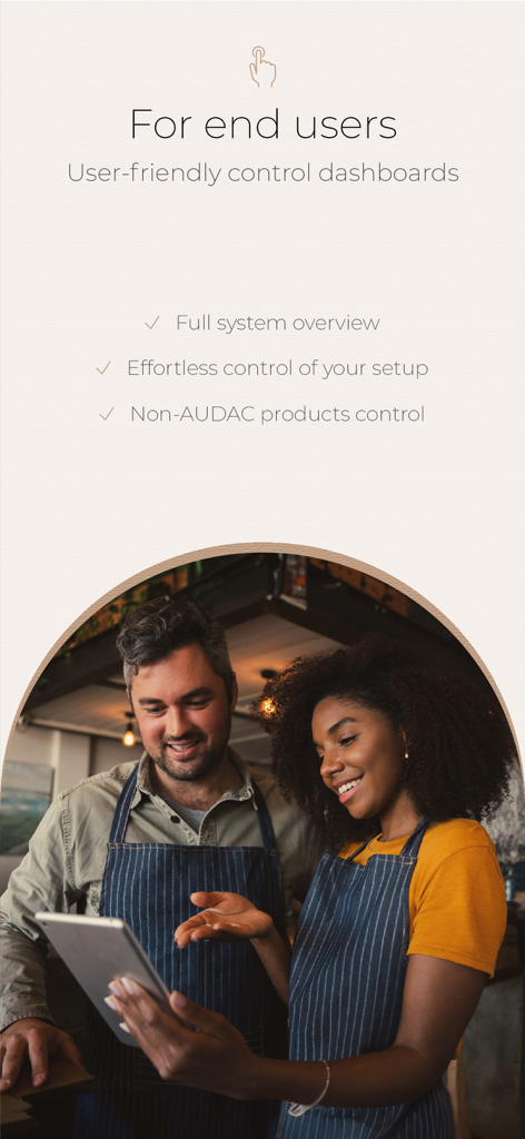 Two restaurant managers using a tablet to manage their venue audio with the AUDAC Touch 2 app