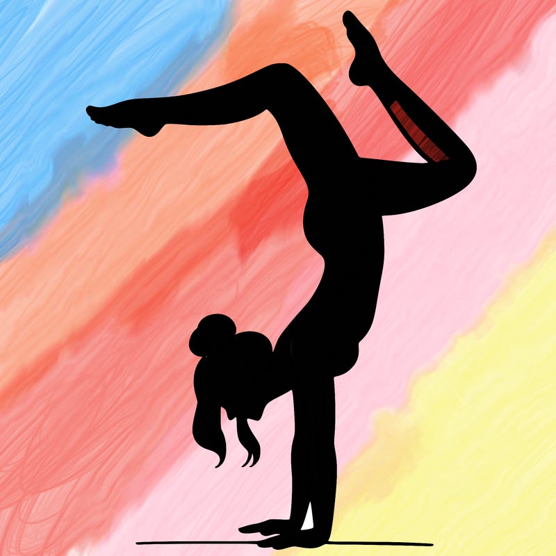 a woman doing a handstand