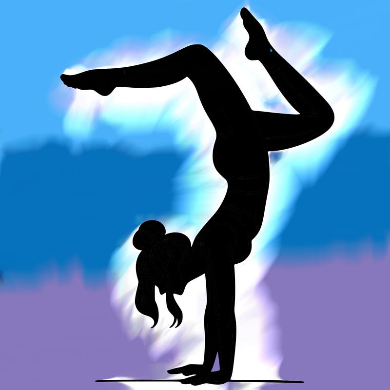a woman doing a handstand