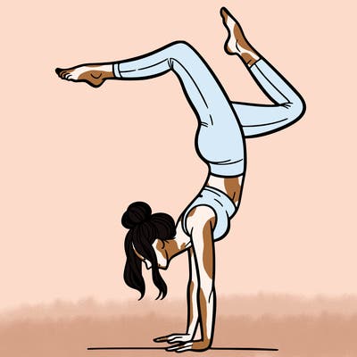 a woman doing a handstand