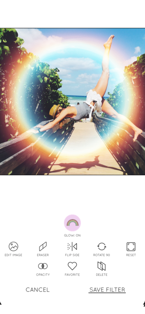 Rainbow Love - A beach photo with a circular rainbow glow effect edited using the Rainbow Love app.