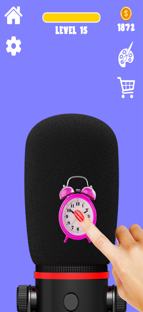 ASMR 게임 앱의 스튜디오 마이크에서 핑거로 분홍색 알람 시계를 누르고 있는 모습
