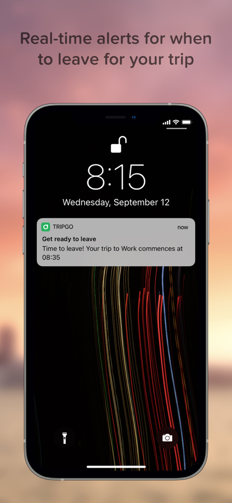 TripGo - iPhone lock screen showing a TripGo real-time alert for when to leave for a trip