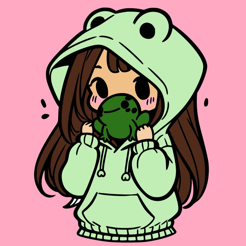 a girl holding a froggy hoodie