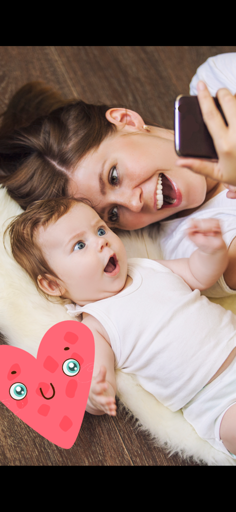 My funny RATTLE for baby! - A happy mother and her excited baby interacting with the digital rattle app on a smartphone