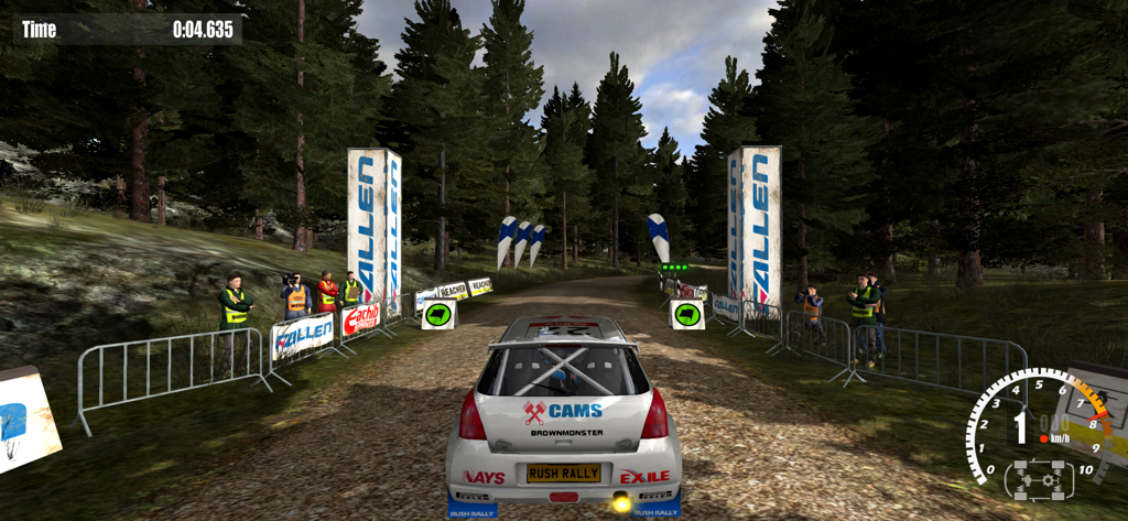 A white rally car at the starting line of a dirt track in a forest setting within the Rush Rally 3 game.