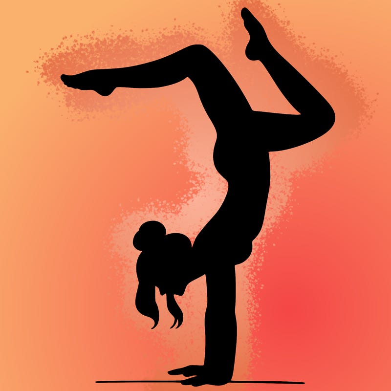 a woman doing a handstand