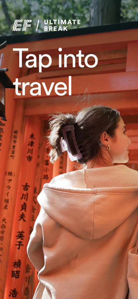 Young woman traveler in front of orange Torii gates with the text Tap into travel