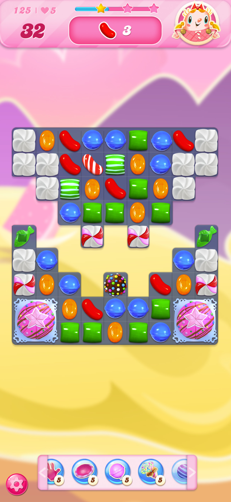 A gameplay screenshot of Candy Crush Saga showing a colorful match 3 puzzle board with various candies and boosters