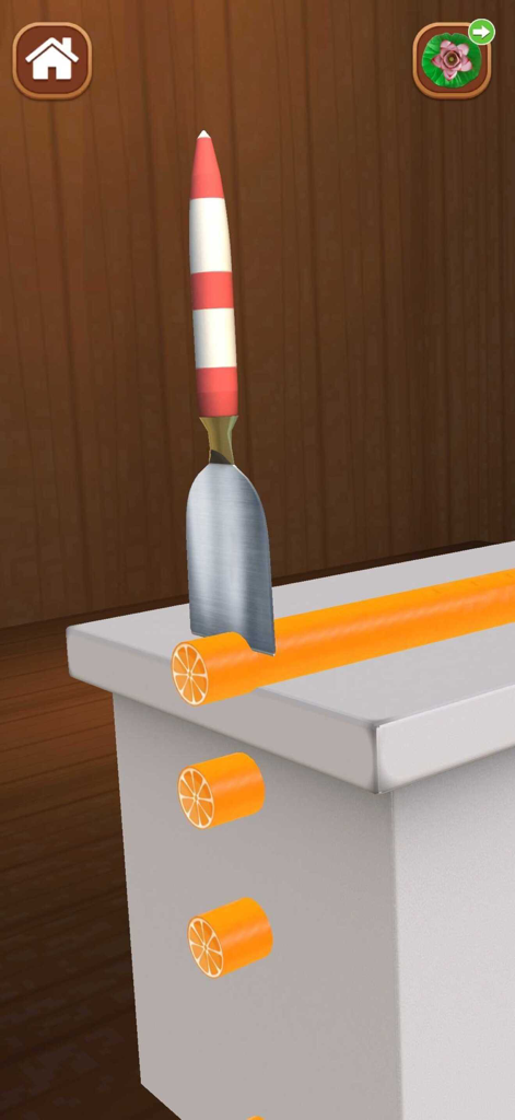 A 3D simulation of a knife slicing a long orange cylinder into small pieces as part of a relaxing sensory game