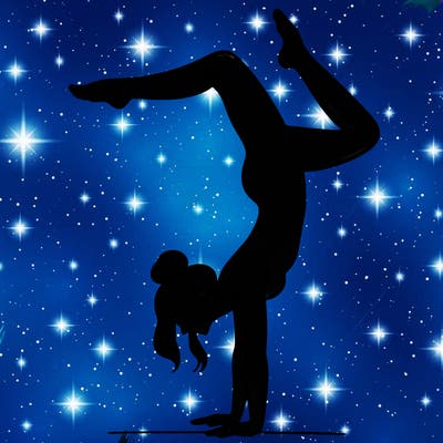 a woman doing a handstand