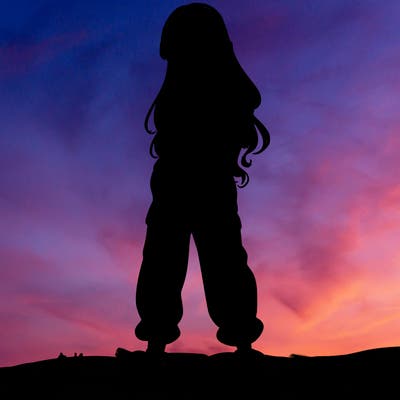 girl in baggy pants crop top and long hair