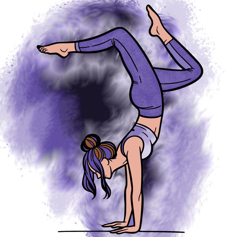 a woman doing a handstand