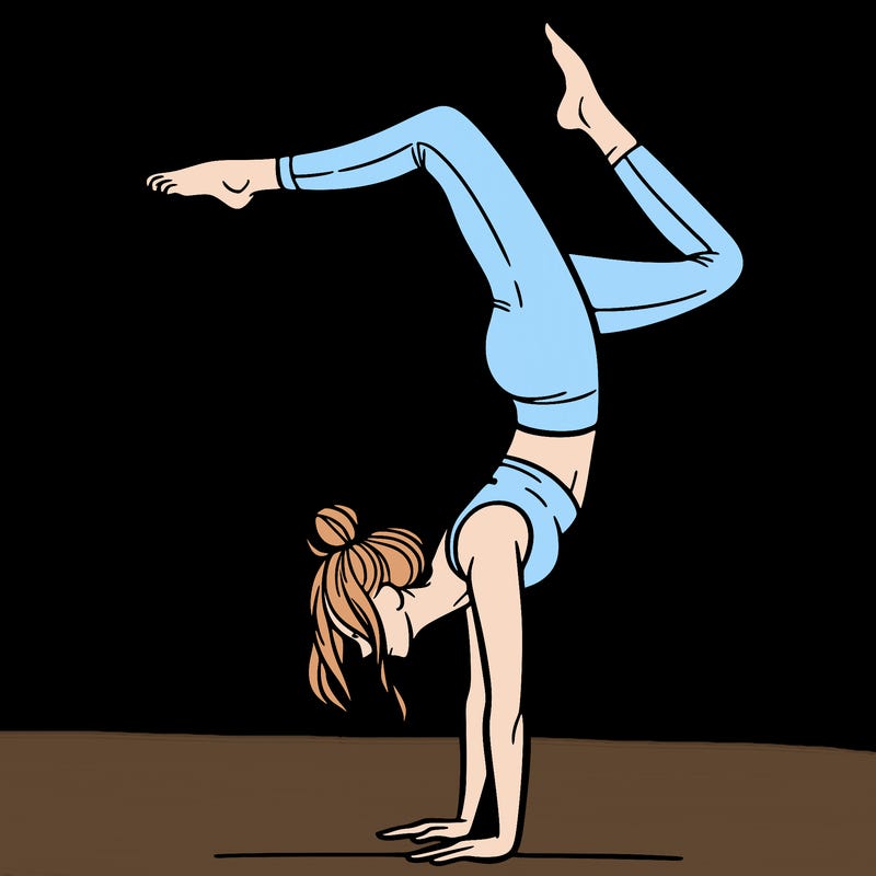 a woman doing a handstand