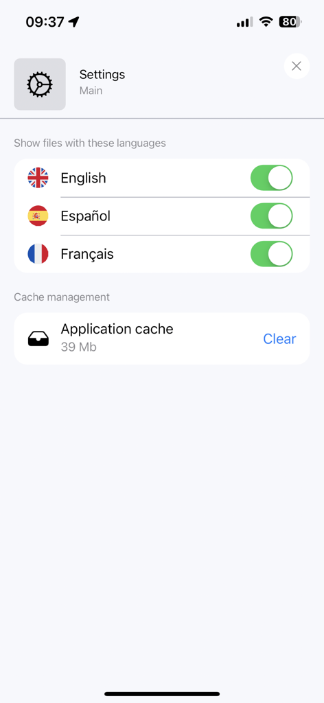 HUMAN.de - HUMAN.de app settings screen showing language selection toggles for English, Spanish, and French, and a cache management clear button.