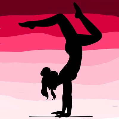 a woman doing a handstand