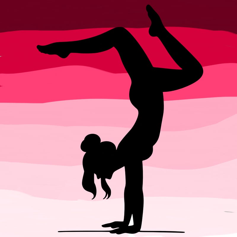 a woman doing a handstand