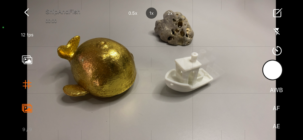 Camera interface of Stop Motion Plus app showing onion skinning for animating a gold fish and boat.