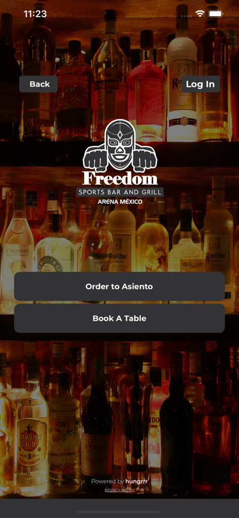 Freedom Arena mobile app landing page with bar background and options to order to seat or book a table