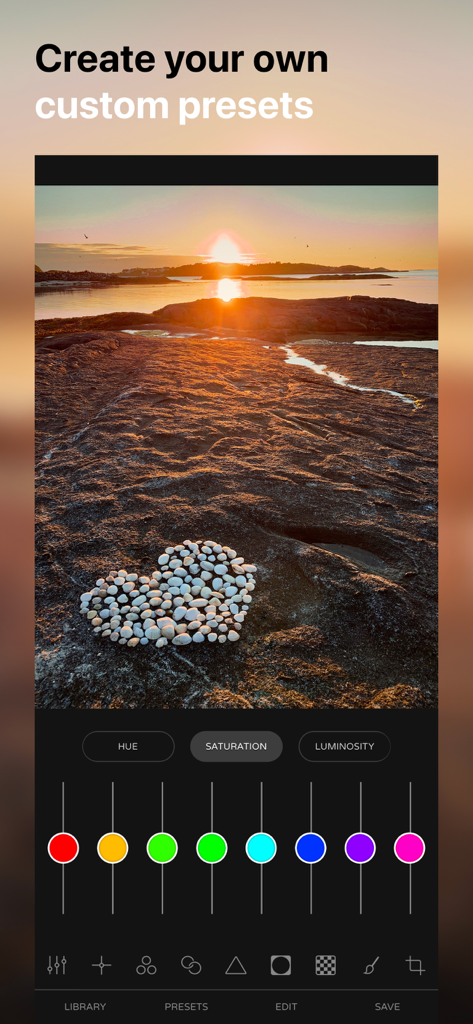 Ultralight app interface showing color saturation editing tools on a sunset photo with a stone heart.