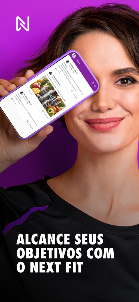 A smiling woman holding a smartphone showing the Next Fit app timeline with instructor updates and fitness products