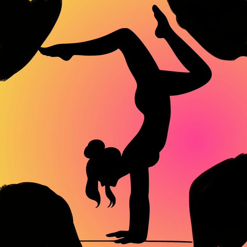 a woman doing a handstand