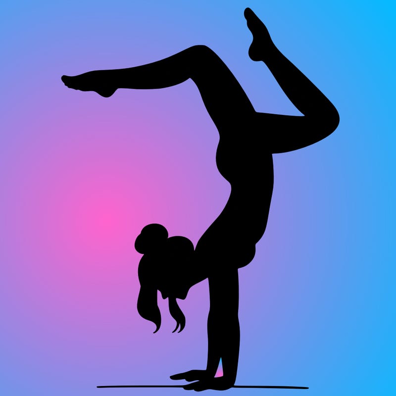a woman doing a handstand