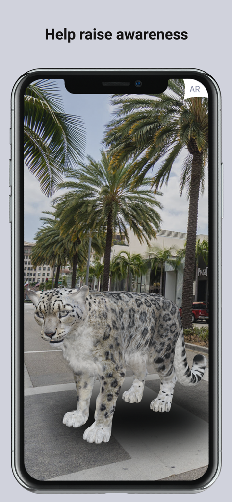 A smartphone screen displaying a 3D augmented reality snow leopard standing on a city sidewalk surrounded by palm trees