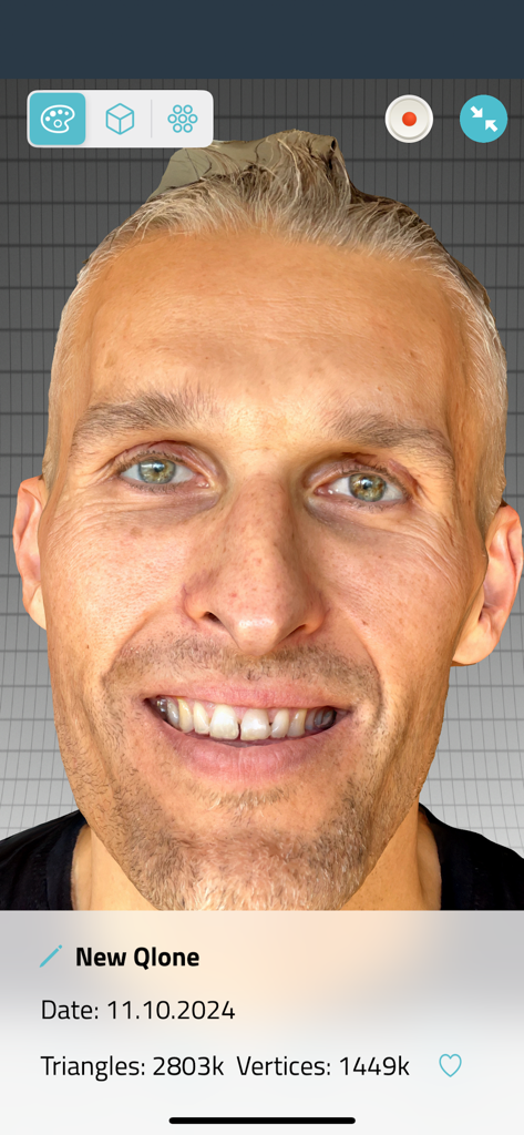 Qlone Dental Pro 3D Scanner - High resolution 3D face scan of a smiling man in the Qlone Dental Pro app interface showing detailed mesh data