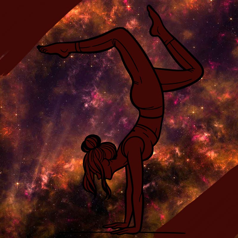 a woman doing a handstand