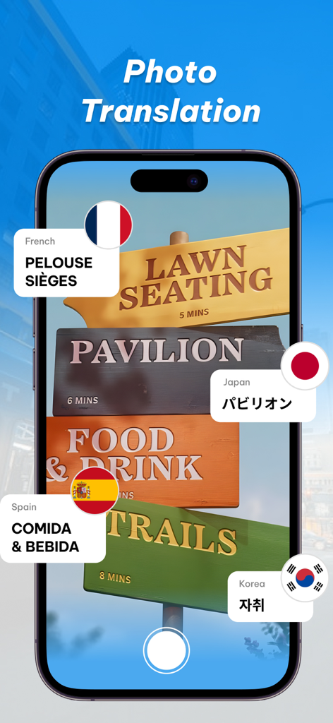SpeakEasy Translator - A smartphone using the SpeakEasy Translator app to translate text on outdoor wooden signs into multiple languages including French Japanese Spanish and Korean