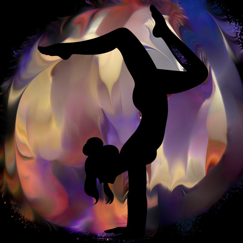 a woman doing a handstand