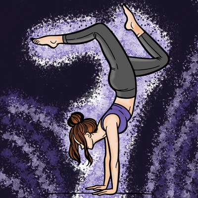 a woman doing a handstand