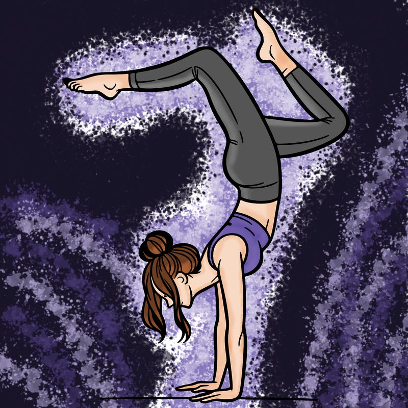 a woman doing a handstand