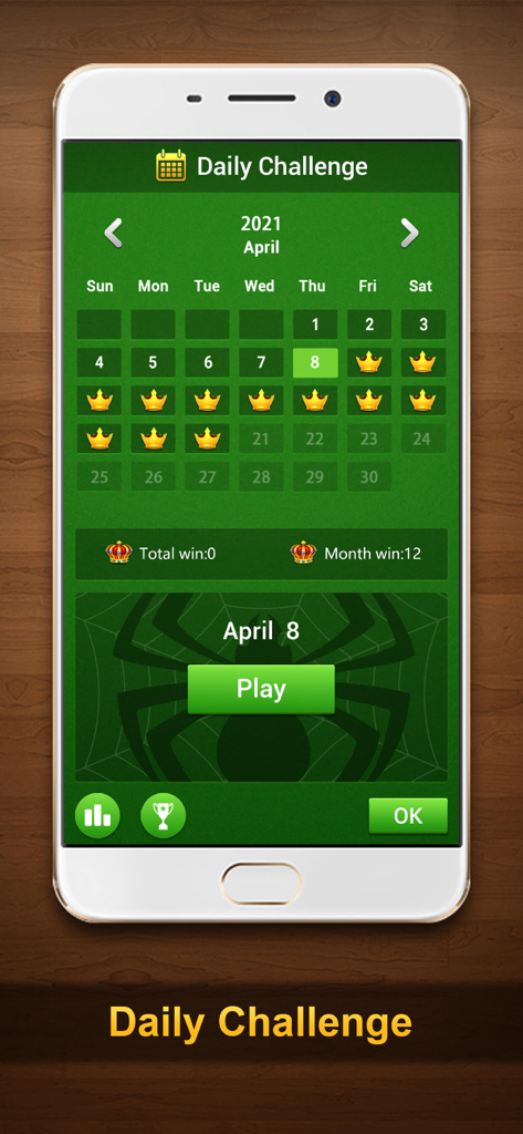 Spider Turbo - Solitaire Card - Daily Challenge calendar screen in Spider Turbo Solitaire showing earned crowns and monthly progress