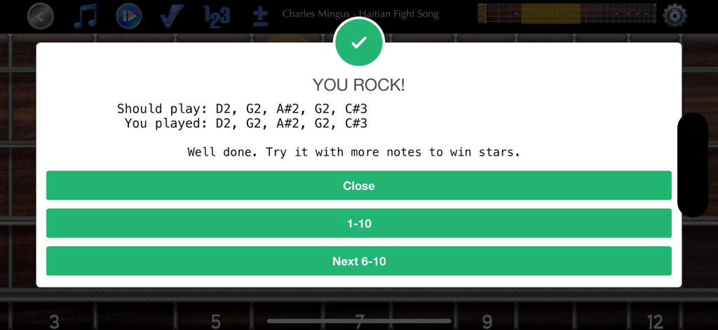 Bass Guitar Tutor - Mensaje de éxito y retroalimentación de notas en un diapasón de bajo eléctrico en la aplicación Tutor de Bajo Eléctrico.