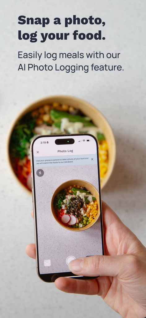 A person using the Cronometer app AI photo logging feature to track a healthy meal bowl