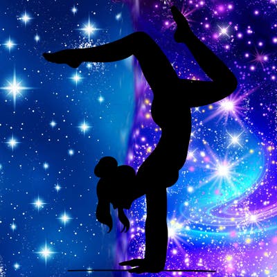 a woman doing a handstand