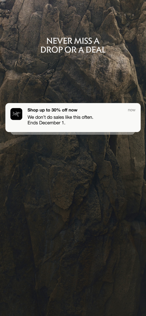 Arc'teryx - Outdoor Gear Shop - A push notification from the Arcteryx app announcing a thirty percent discount on outdoor gear over a background of rocks