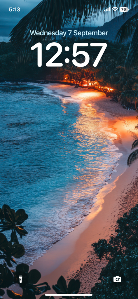 4K Wallpaper - HD Wallpaper - iPhone lock screen showing a high-definition 4K beach wallpaper with glowing shoreline at dusk