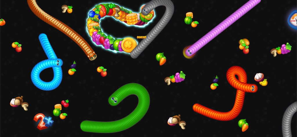 Snake Game - Worms io Zone - Colorful cartoon snakes and worms competing to eat fruit in a dark arena.